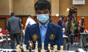 Dommaraju Gukesh surveys the board during his round nine game against the Azerbaijan team at the 44th Chess Olympiad on August 7