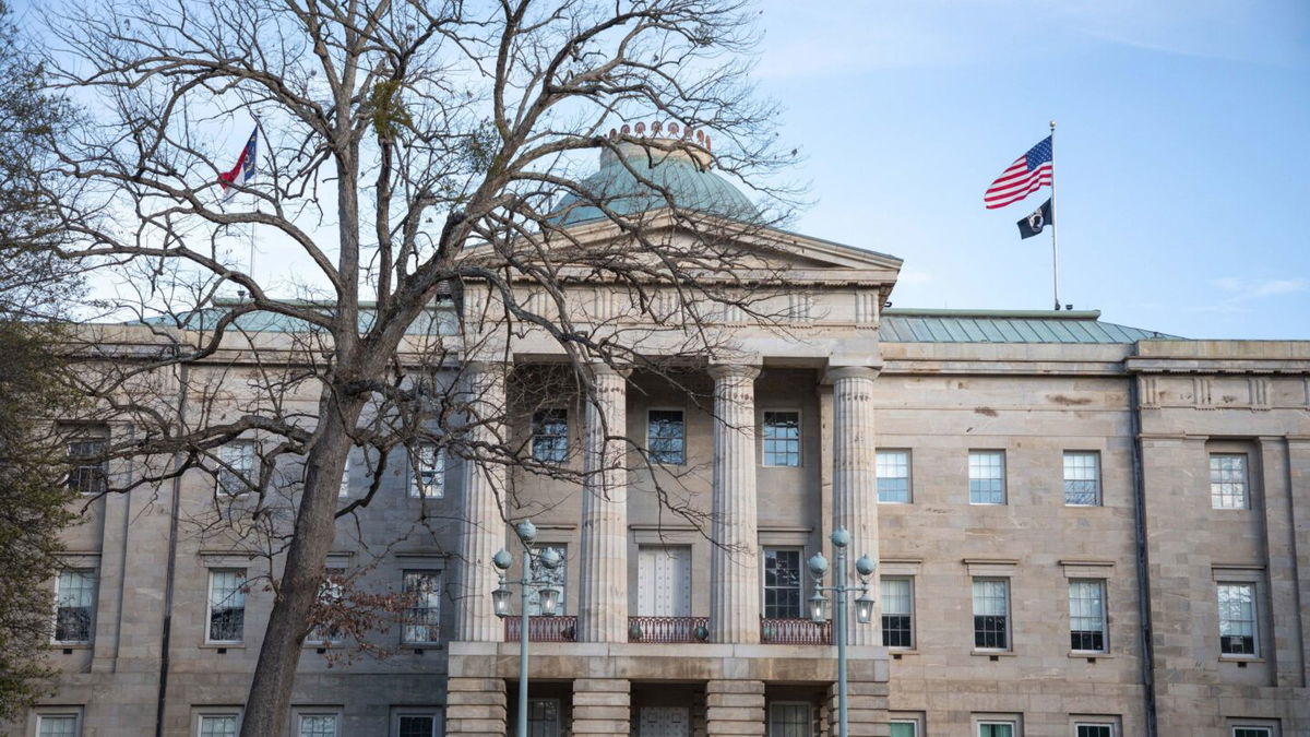 <i>Logan Cyrus/AFP/Getty Images</i><br/>Law enforcement stand guard outside of the state capitol building in downtown Raleigh