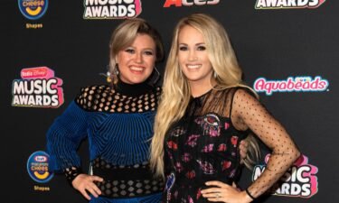 Kelly Clarkson (L) and Carrie Underwood attend the 2018 Radio Disney Music Awards at Loews Hollywood Hotel on June 12