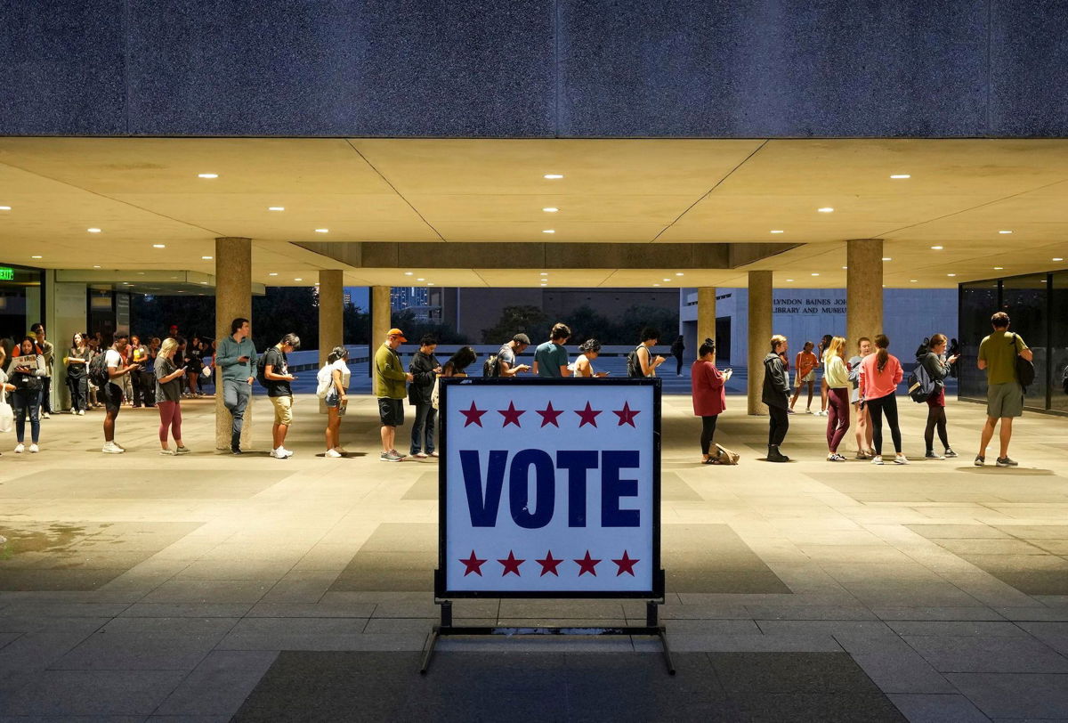 <i>Jay Janner/Austin American-Statesman/AP/FILE</i><br/>At least 11 states have enacted 13 restrictive voting laws this year. Voters here wait in line at a polling place in Austin