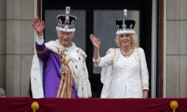 King Charles III and Queen Camilla are seen on the Buckingham Palace balcony on May 6 in London