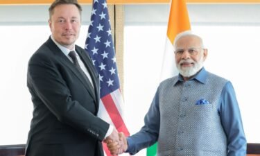 India's Prime Minister Narendra Modi shakes hand with Tesla chief executive Elon Musk during their meeting in New York City