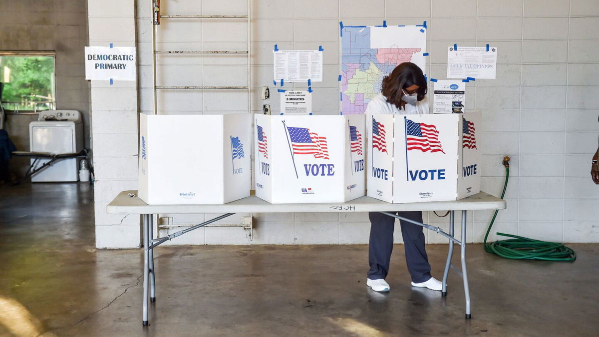 <i>Hannah Mattix/The Clarion-Ledger/USA Today Network</i><br/>A Jackson resident stops to vote before work in the Mississippi Congressional primary at Fire Station 26 in Jackson