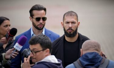Andrew Tate and his brother Tristan leave the Bucharest Tribunal