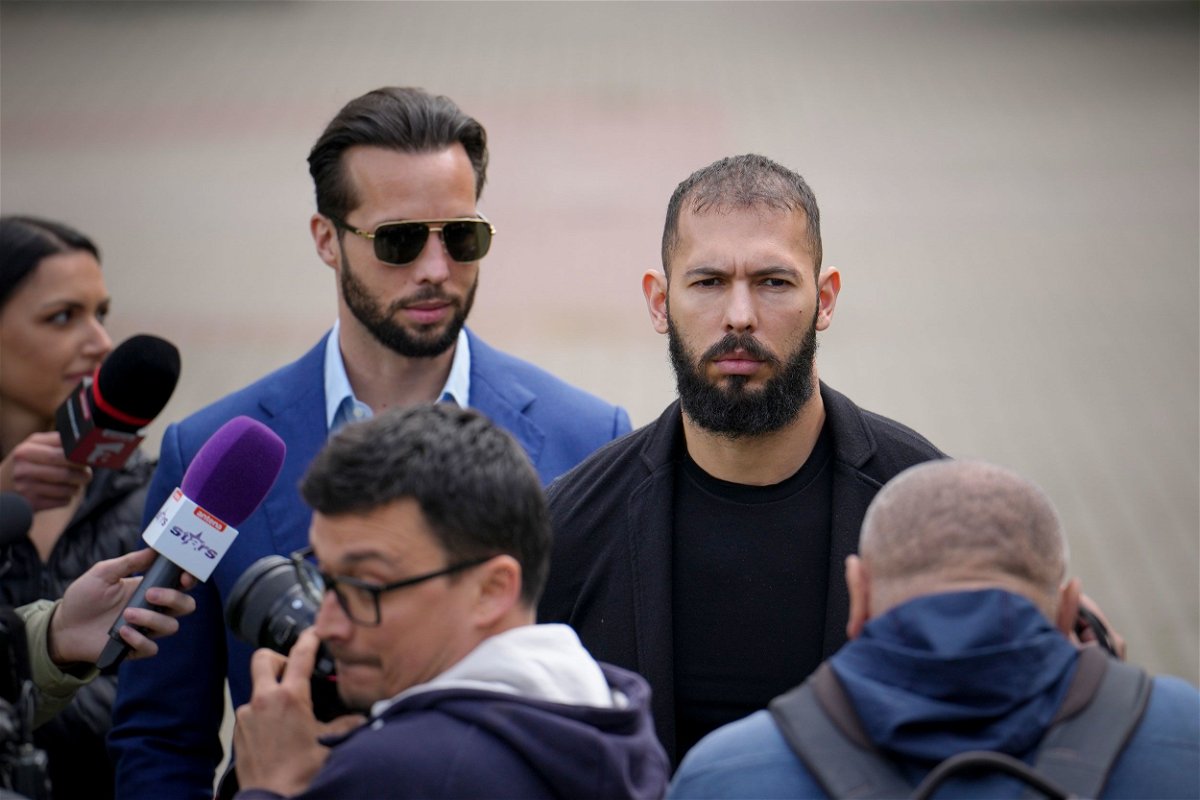 <i>Vadim Ghirda/AP</i><br/>Andrew Tate and his brother Tristan leave the Bucharest Tribunal
