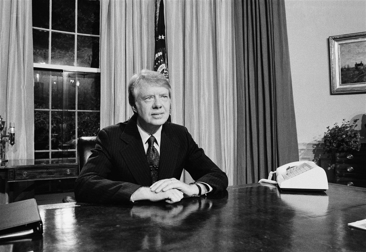 <i>Charles W. Harrity/AP</i><br/>President Jimmy Carter is seen here at his desk in the Oval Office prior to delivering a speech in April 1977.