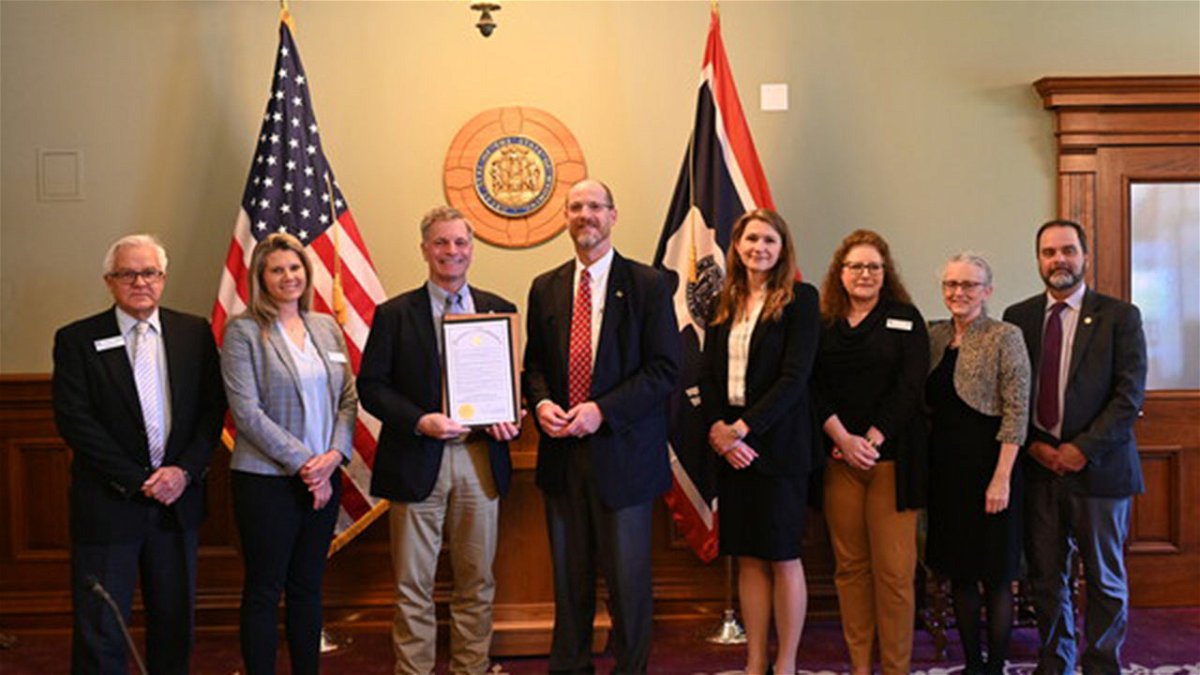 DEQ leadership receives signed proclamation from Governor. From left: Deputy Director and ISD Administrator Alan Edwards, SHWD Administrator Suzanne Engels, Governor Mark Gordon, Director Todd Parfitt, WQD Administrator Jennifer Zygmunt, Management Services Administrator Kimber Wichmann, AQD Administrator Nancy Vehr, LQD Administrator Kyle Wendtland