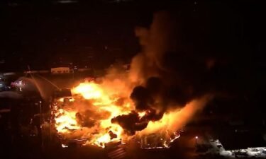 Crews are battling a massive pallet fire in south Phoenix.
