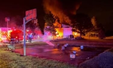 A fire sparked by fireworks late Saturday night resulted in injuries to four people and the complete loss of a building in De Soto