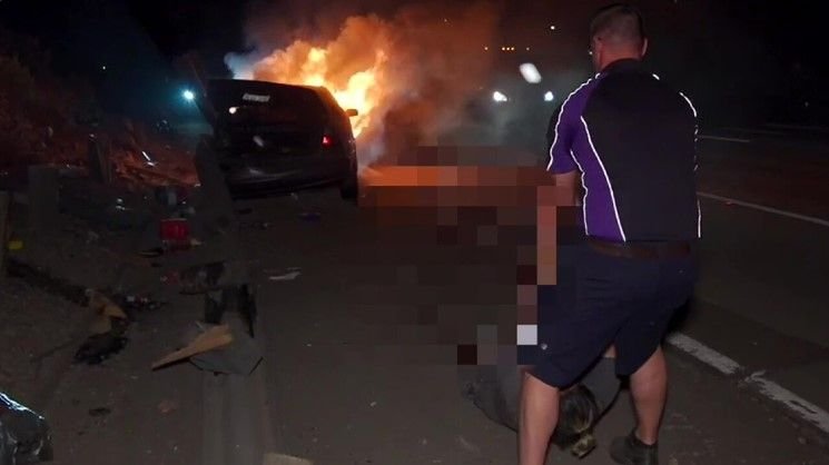 <i></i><br/>A FedEx driver pulled a driver out of a car that crashed and burst into flames on Interstate 15 on July 26.