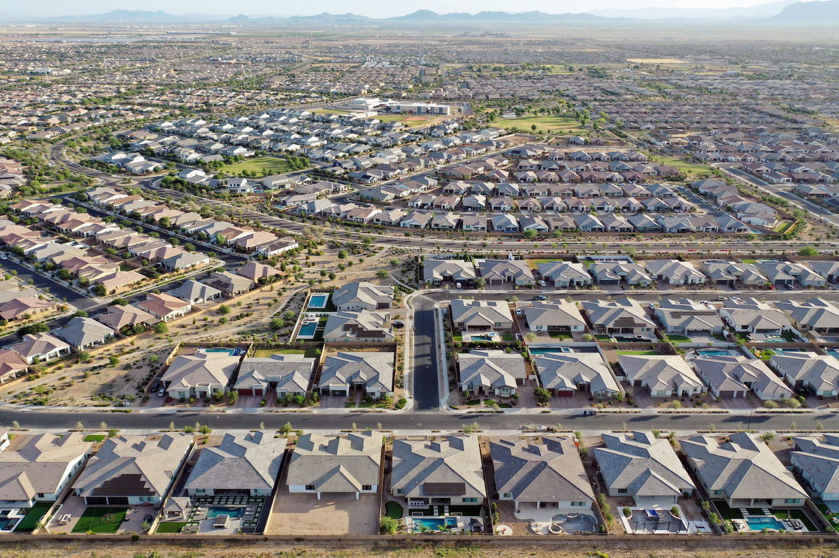 Middle-income Americans think prosperity is within reach. Pictured is an aerial view of homes in the Phoenix suburbs on June 9, in Queen Creek, Arizona.