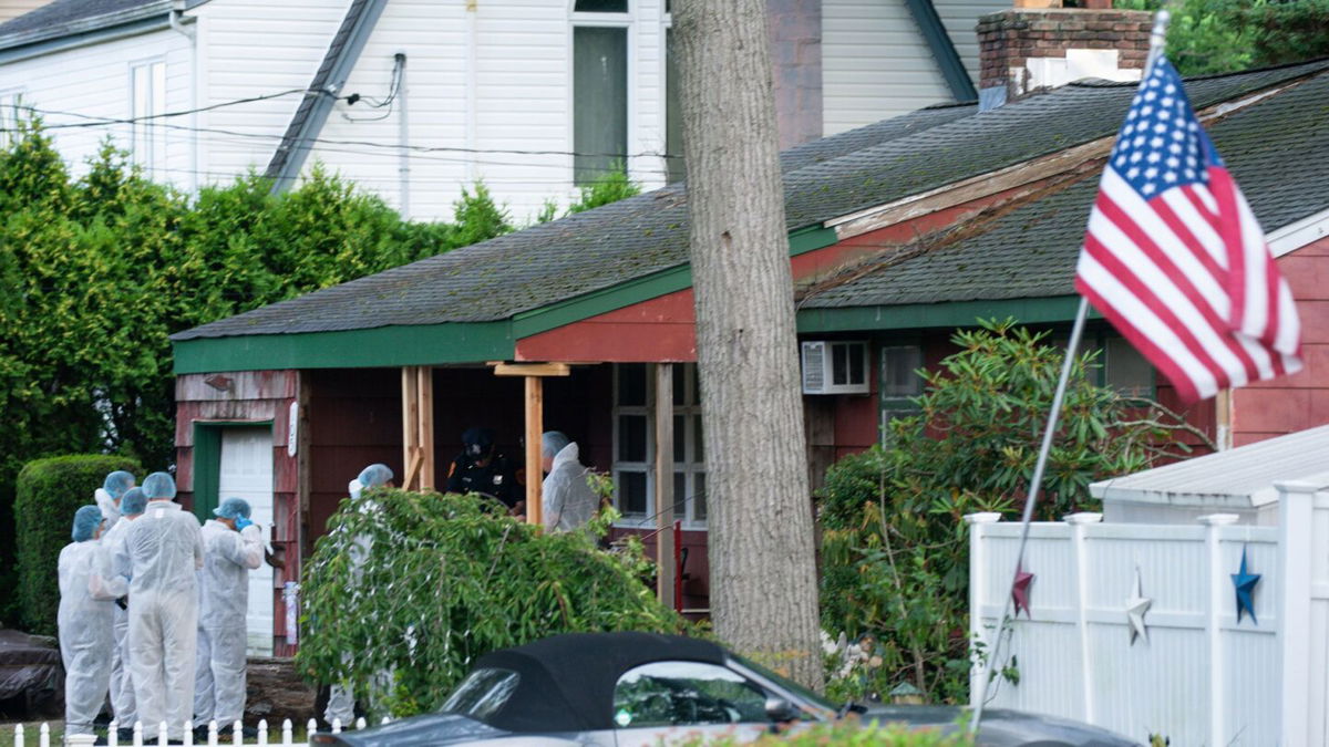 <i>Eduardo Munoz Alvarez/AP</i><br/>Crime laboratory officers arrive to a house Friday