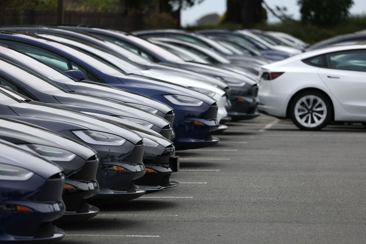 <i>Justin Sullivan/Getty Images</i><br/>Brand new Tesla cars are displayed on the sales lot at a Tesla dealership on May 16 in Colma