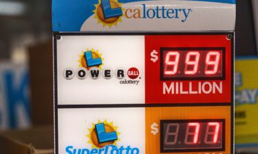 A California Lottery Powerball sign displays an amount of $999 million at Won Won Mini Market liquor store in Los Angeles on Tuesday