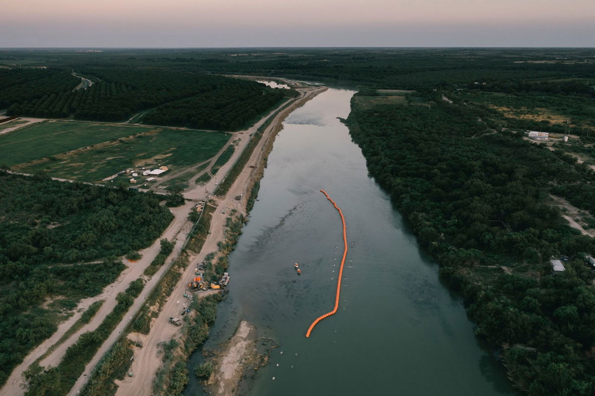 <i>Jordan Vonderhaar/Bloomberg/Getty Images</i><br/>A string of buoys used as a border barrier on the Rio Grande River in Eagle Pass