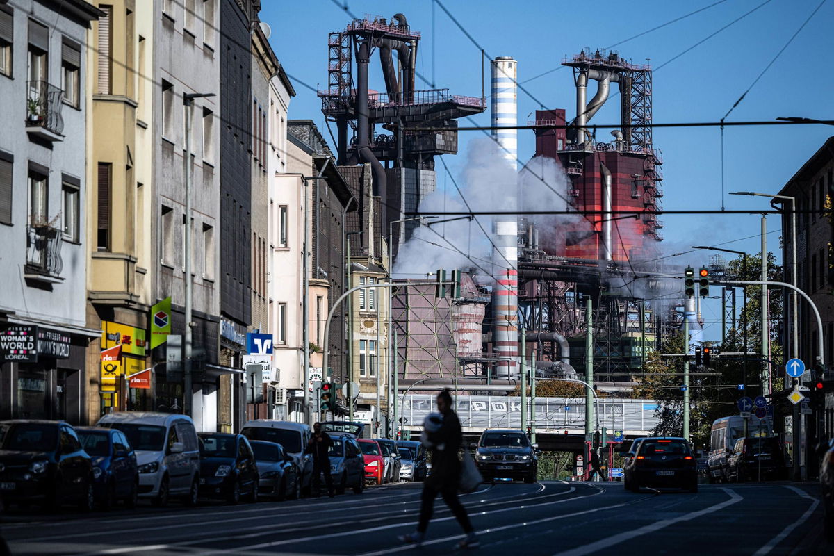 <i>Lukas Schulze/Getty Images/File</i><br/>People cross a street as the ThyssenKrupp steel factory looms behind on October 6