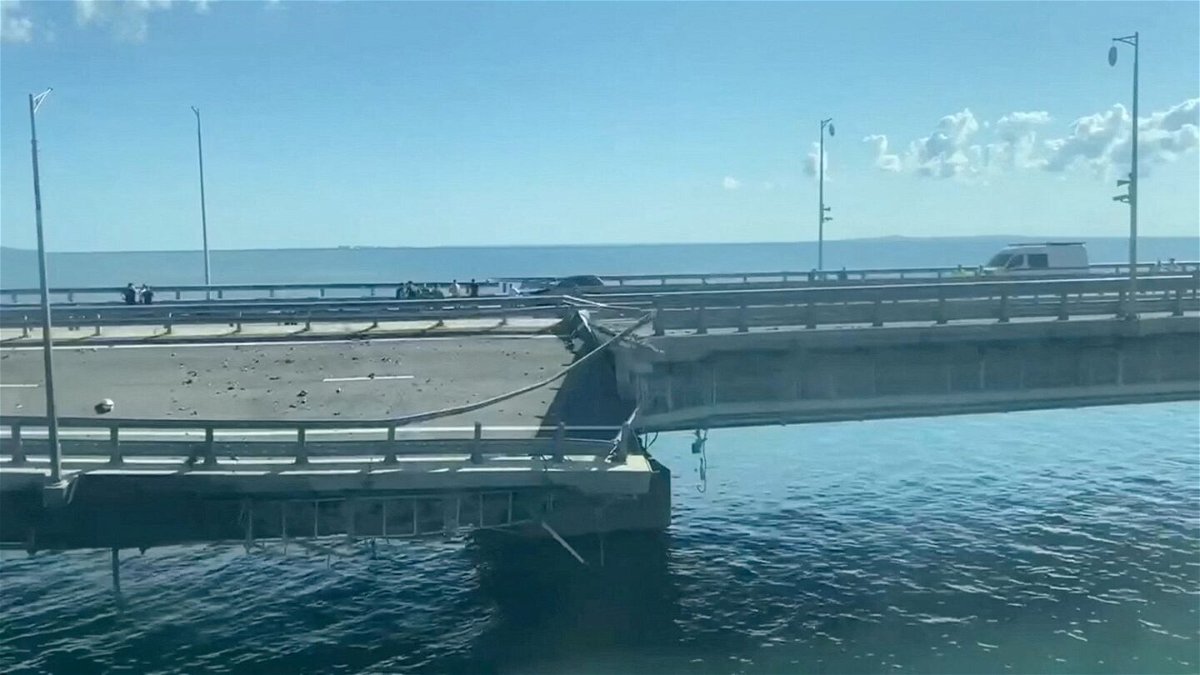 <i>Сrimea24tv/Reuters</i><br/>A view shows the section of a road split and sloping to one side following an alleged attack on the Crimea Bridge