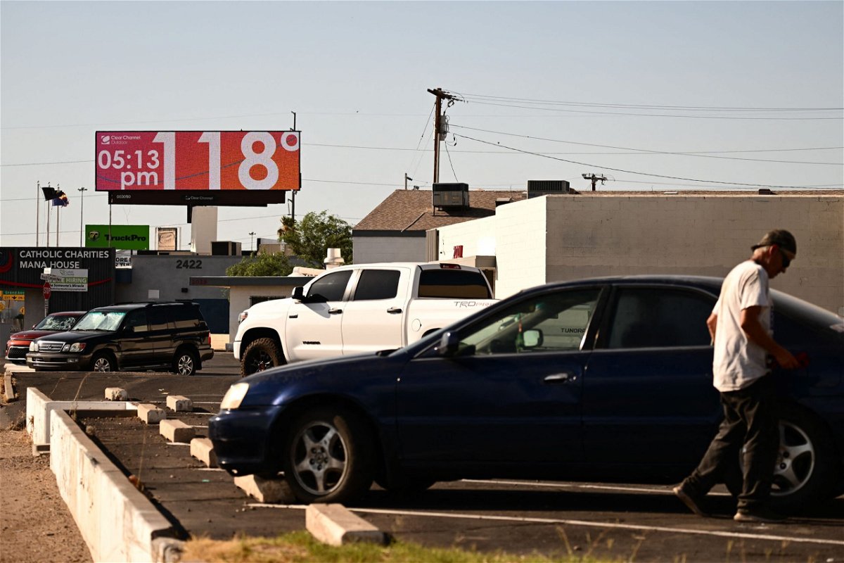 <i>Patrick T. Fallon/AFP/Getty Images</i><br/>A billboard displays a temperature of 118 degrees Fahrenheit (48 degrees Celcius) during a record heat wave in Phoenix