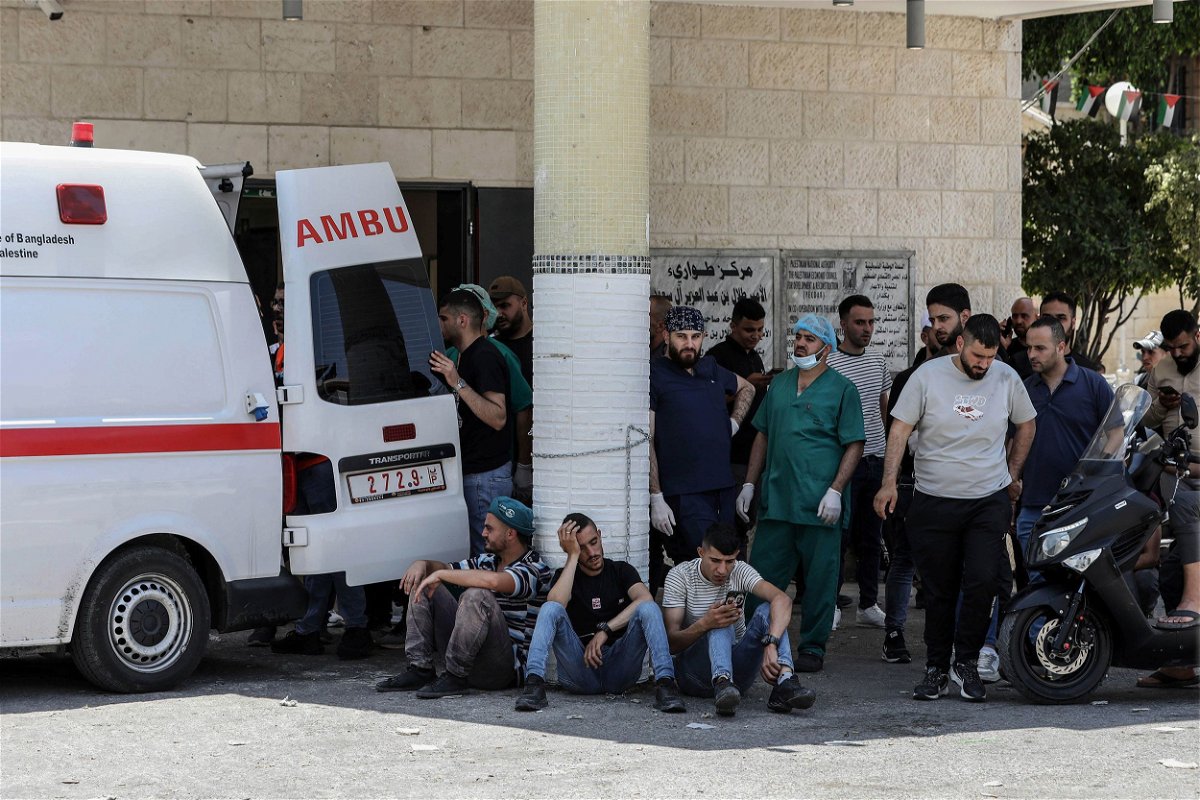 <i>Ayman Nobani/picture-alliance/dpa/AP</i><br/>Palestinians wait outside a hospital while paramedics transport injured people during a large-scale Israeli military operation in the West Bank town of Jenin. At least eight Palestinians were killed