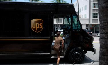 A UPS driver makes a delivery on June 30 in Miami