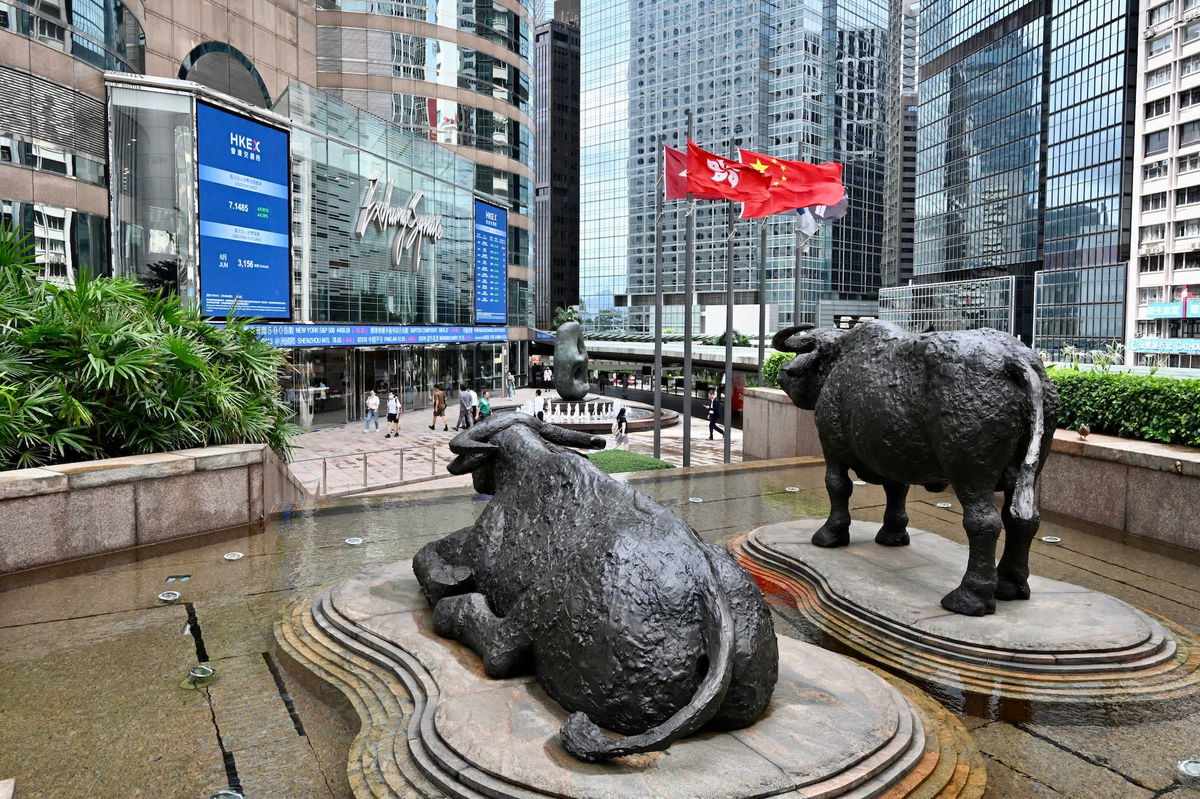 <i>Li Zhihua/China News Service/VCG/Getty Images/FILE</i><br/>Bull statues are seen on the Exchange Square complex