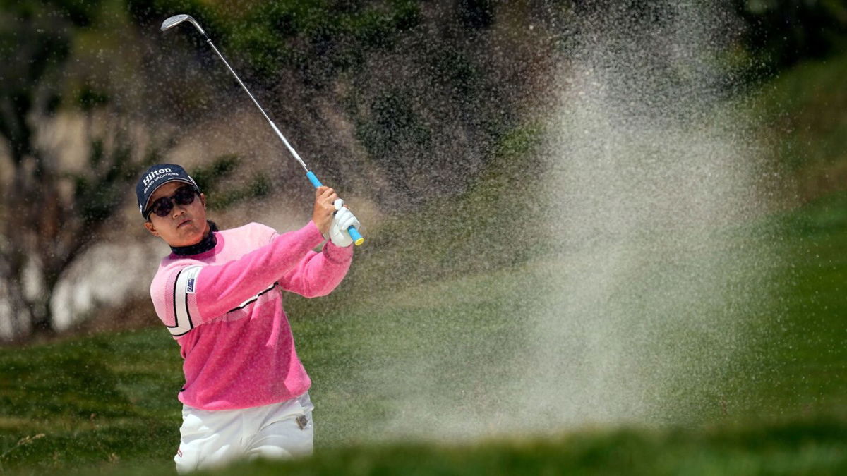 <i>Darron Cummings/AP</i><br/>Hataoka hits from a bunker at Pebble Beach.