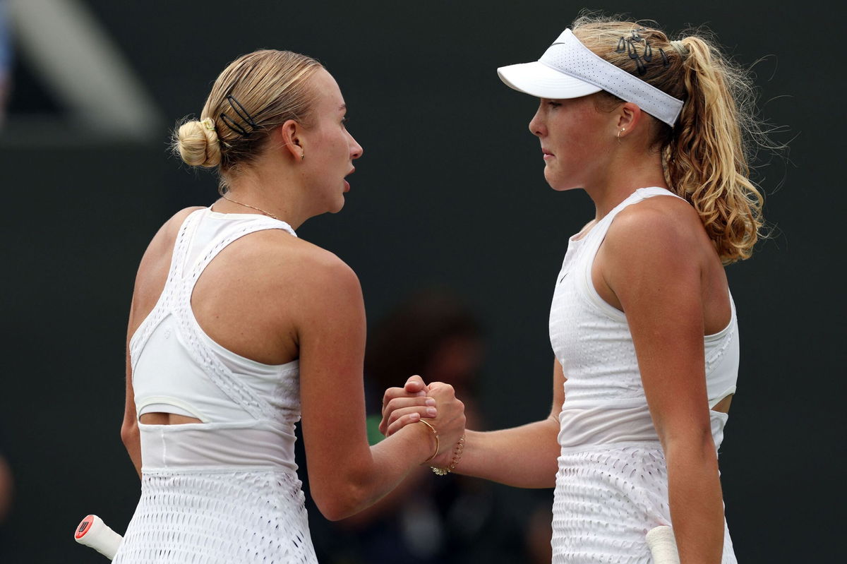 <i>Adrian Dennis/AFP/Getty Images</i><br/>Russia's Mirra Andreeva (R) shakes hands with compatriot Anastasia Potapova after their third-round match.