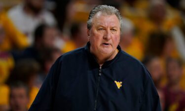 Bob Huggins watches from the bench during the first half of an NCAA college basketball game against Iowa State on February 27