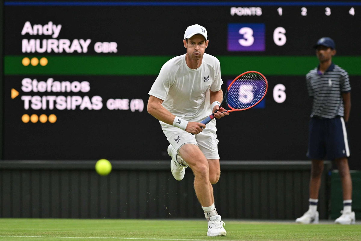 <i>Glyn Kirk/AFP/Getty Images</i><br/>Andy Murray runs to play a return against Tsitsipas.