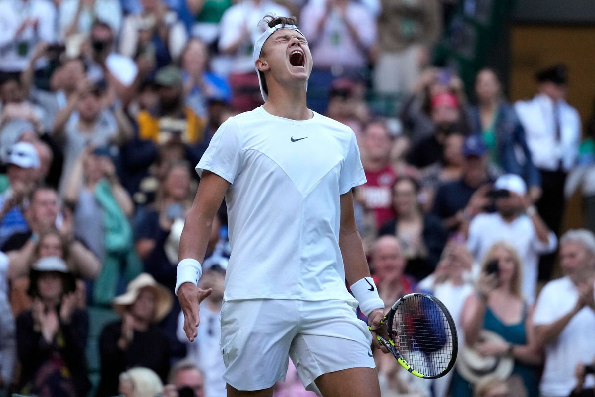 <i>Kirsty Wigglesworth/AP</i><br/>Denmark's Holger Rune celebrates winning his men's singles match against Bulgaria's Grigor Dimitrov.