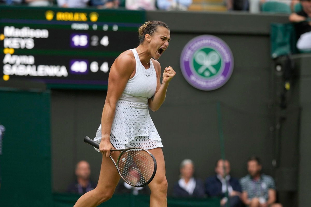 <i>Alastair Grant/AP</i><br/>Aryna Sabalenka celebrates after beating Madison Keys in the Wimbledon quarterfinals.