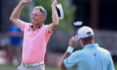 Langer toasts a historic win.