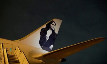 A view of a photograph of Iranian protester Mahsa Amini on the tail of the charter plane of the Brazilian women's football team in Brisbane