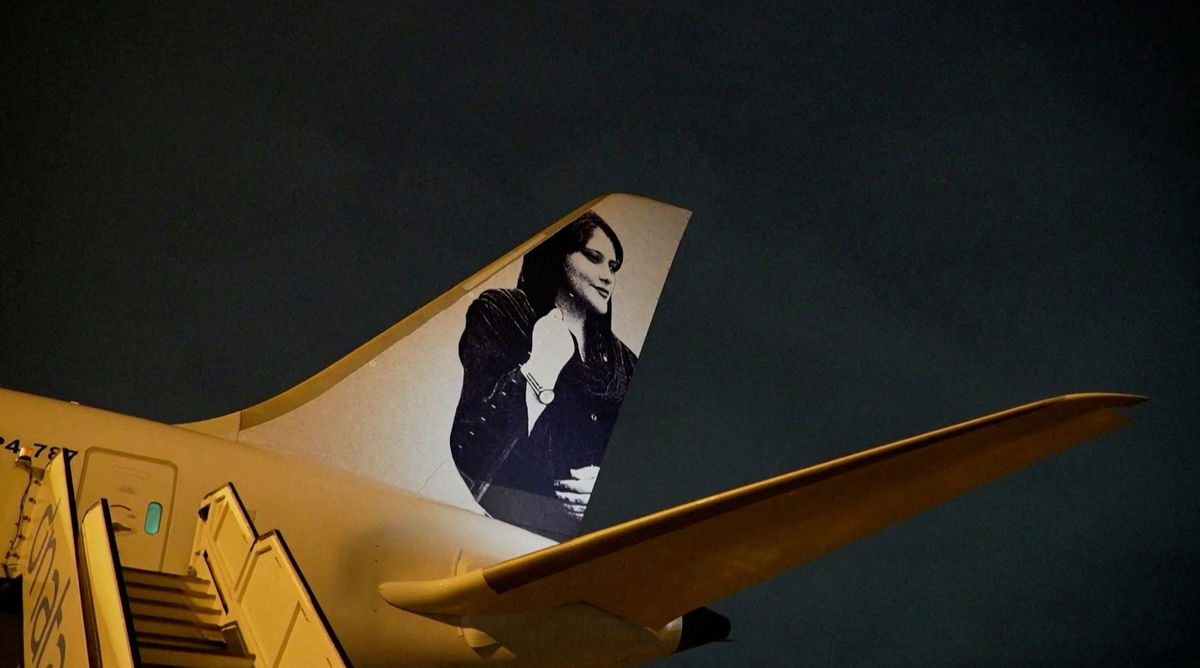 <i>FIFA/Handout/Reuters</i><br/>A view of a photograph of Iranian protester Mahsa Amini on the tail of the charter plane of the Brazilian women's football team in Brisbane