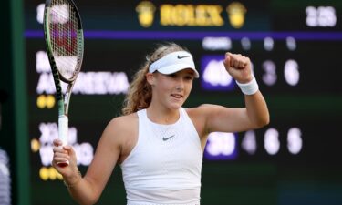 Andreeva celebrates defeating Wang Xiyu in the first round of Wimbledon.