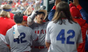 Shohei Ohtani is congratulated after hitting a home run in the fifth inning against the Texas Rangers.