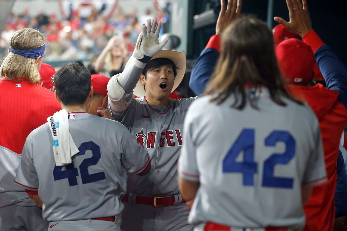 <i>Tim Heitman/Getty Images</i><br/>Shohei Ohtani is congratulated after hitting a home run in the fifth inning against the Texas Rangers.