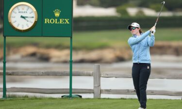 Maguire plays her shot from the seventh tee.