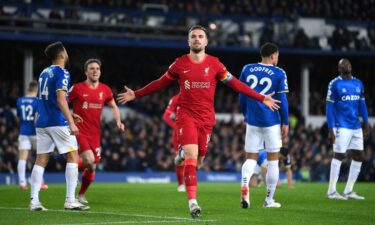 Henderson wears a rainbow captain's armband in support of the Rainbow Laces campaign during a match.