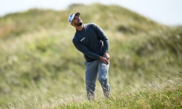 Clark chips onto the 14th green to set up a brilliant bogey save.