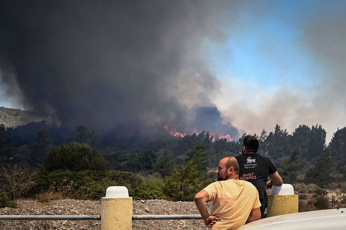 <i>Spyros Bakalis/AFP/Getty Images</i><br/>Smoke rises from a wildfire near the village of Vati in southern Rhodes on July 25.