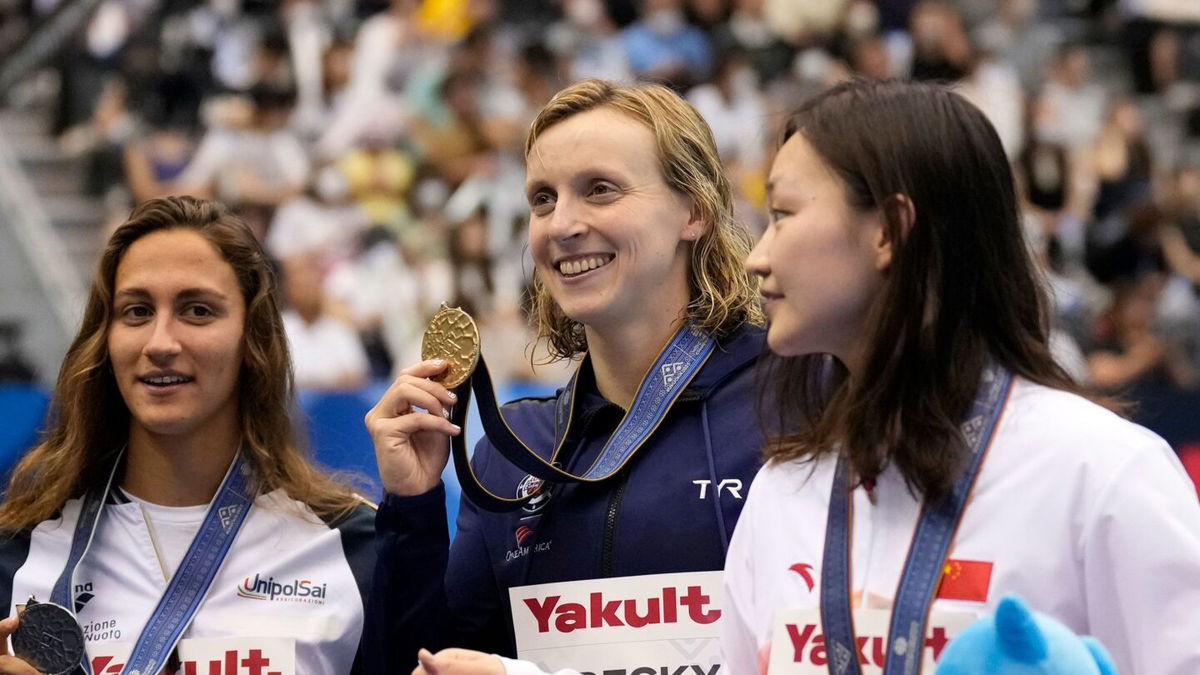 <i>Lee Jin-man/AP</i><br/>Katie Ledecky celebrates with her gold medal after winning the women's 1