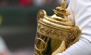 Spanish tennis player Rafael Nadal holds the Wimbledon trophy