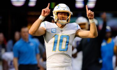 Justin Herbert reacts after a play during the Los Angeles Chargers' game against the Atlanta Falcons at Mercedes-Benz Stadium on November 6