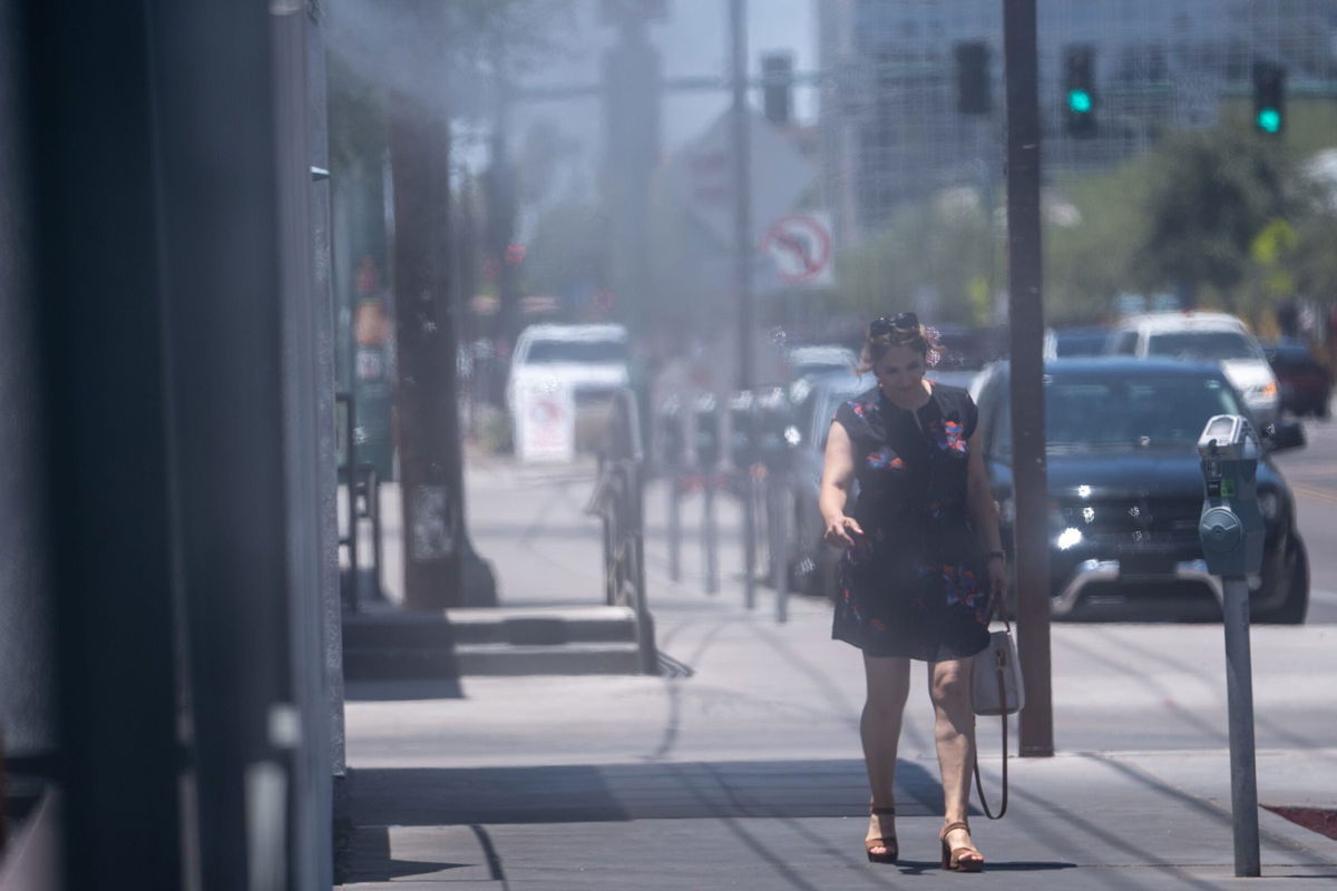 <i>Joel Angel Juarez/The Republic/USA Today Network</i><br/>A person walks along Roosevelt Row in Phoenix on July 5. High temperatures there could stay north of 110 degrees through this week.