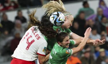 Ireland's defenders Niamh Fahey and Louise Quinn compete for the ball against Canada's defender Vanessa Gilles.