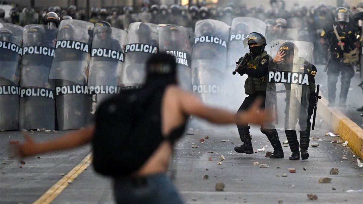 <i>Ernesto Benavides/AFP/Getty Images/FILE</i><br/>Demonstrators clash with riot police in January during a protest against the government of Dina Boluarte.