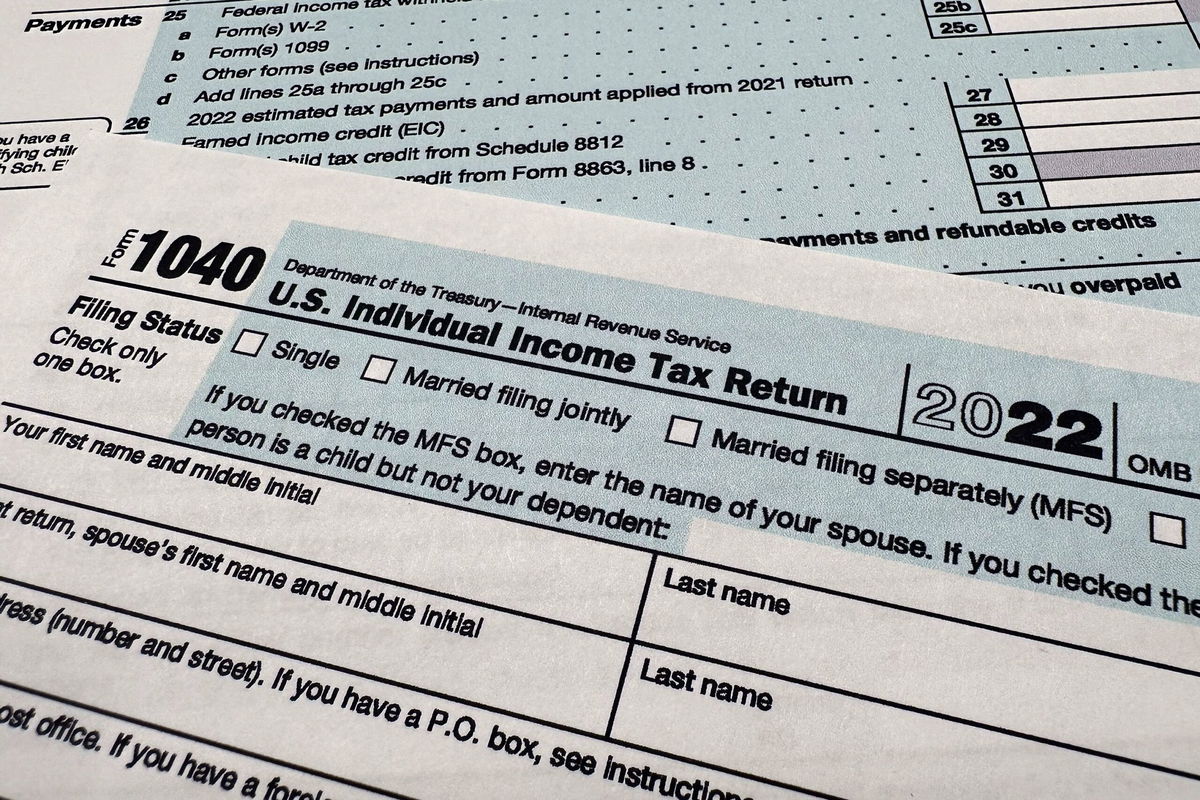 <i>Jon Elswick/AP</i><br/>The Internal Revenue Service 1040 tax form for 2022 is photographed