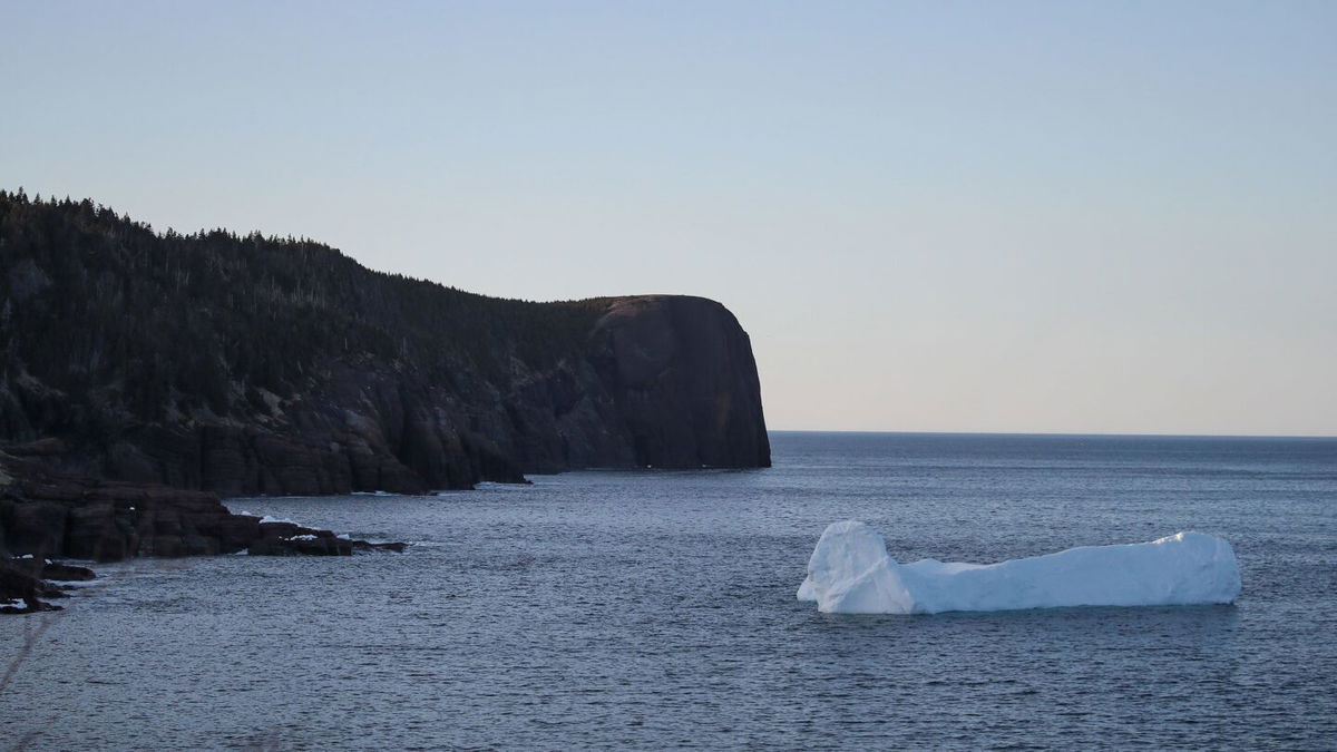 <i>Drew Angerer/Getty Images</i><br/>An iceberg floats in Flatrock Cove