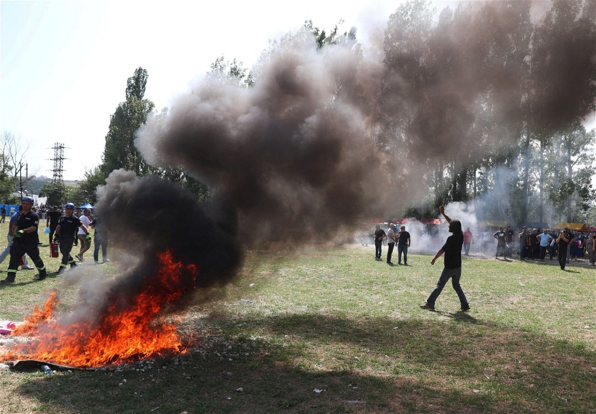 <i>Irakli Gedenidze/Reuters</i><br/>Far-right demonstrators broke through the police cordon and started a fire.